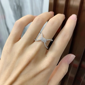 Intricate silver rope knot ring with micro-pave crystals shown on a model's finger