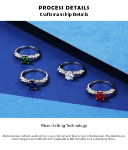 Macro detail of S925 sterling silver rings with four-prong set red, green, blue gems