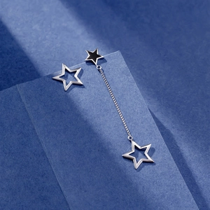Asymmetric S925 sterling silver star earrings with tassels and black enamel finish
