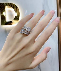 Detailed macro of Asscher cut gemstones set in 925 silver double band luxury ring