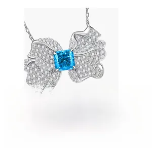Macro shot of 925 silver butterfly necklace with blue square stone and sparkling crystals