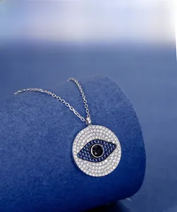 Macro view of 925 sterling silver evil eye pendant with pavé set white 5A zircon stones