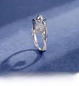 Macro shot of 925 sterling silver ring detail with pave zircon ball and engraved stamp
