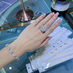 Close-up of S925 sterling silver sunflower bracelet and ring set with pavé cubic zirconia