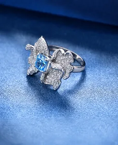 Macro shot of 925 silver butterfly wing ring with blue stone and thick platinum plating