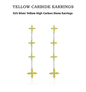 Macro shot of 925 silver petal earrings with yellow carbon stones and tassel details