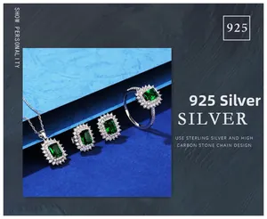 Macro shot of S925 sterling silver jewelry set with emerald cut green gemstones