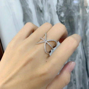 Minimalist 925 sterling silver criss-cross ring with sparkling pavé cubic zirconia