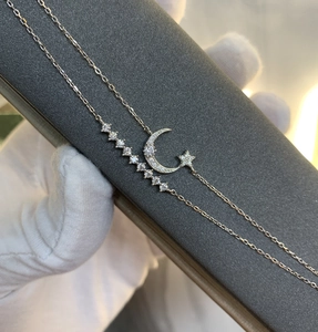 Close-up of S925 silver double-layer star and crescent moon bracelet with zircons