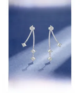 Macro view of S925 sterling silver long drop earrings with micro-pave square crystals