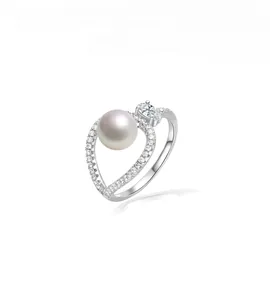 Detailed macro view of 925 sterling silver ring with large pearl and marquise diamond