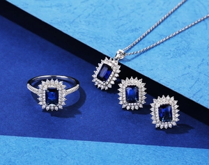 S925 silver jewelry set featuring emerald-cut blue stones with halo diamond accents