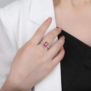 Elegant 925 sterling silver ring with emerald-cut red gemstone and pavé side stones