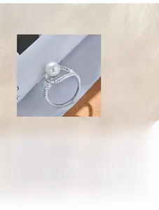Close-up of 925 silver ring featuring white pearl and micro-paved 5A cubic zirconia