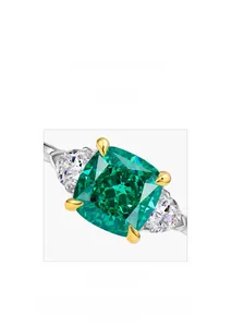 Detail of emerald cut green gemstone ring showing precision micro-setting craftsmanship