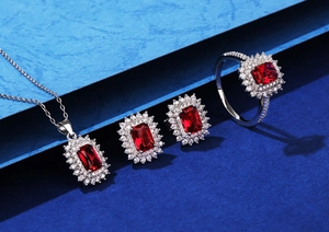 Detailed set of silver jewelry with rectangular red gemstones and double halo zircon pavé