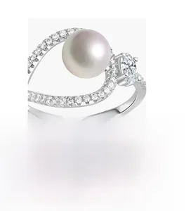 Detailed macro view of 925 silver ring featuring a white pearl and oval carbon diamond
