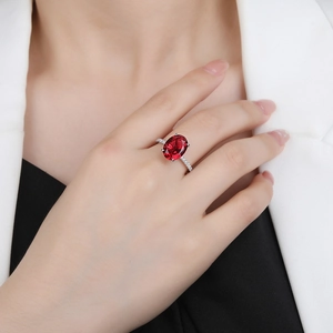 S925 sterling silver ring featuring a large oval red gemstone and pavé accents
