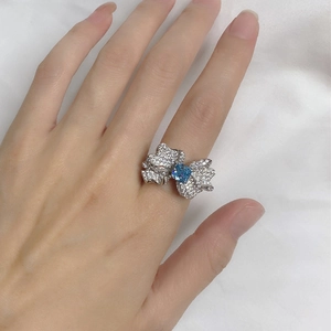 925 silver butterfly ring with blue square carbon diamond shown on hand wearing