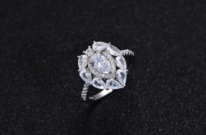 Macro view of teardrop cluster ring featuring pear-cut stones in a prong setting