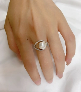 Close-up of 925 sterling silver ring with 9mm pearl and sparkling zircon setting