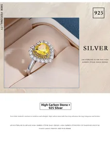 Detail of heart-shaped yellow carbon diamond ring in 925 sterling silver setting