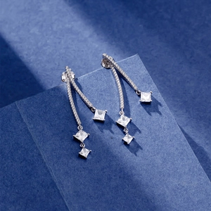 S925 sterling silver long tassel drop earrings with sparkling zircon on blue pedestal