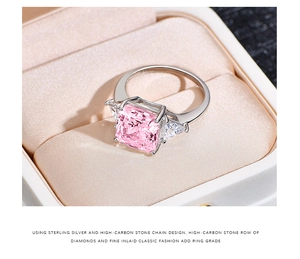 Macro shot of 925 silver ring featuring a large square pink stone and side triangles