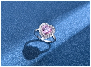 Macro detail of 925 silver ring with pink heart stone and engraved S925 hallmark
