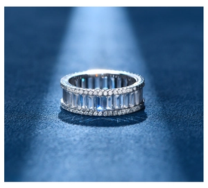 Macro view of S925 silver ring featuring rectangular and round-cut pavé zircons