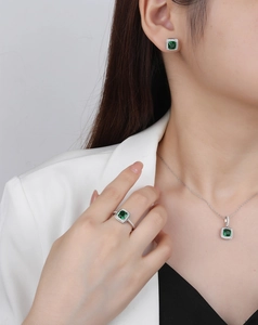 On-model view of S925 silver jewelry set with square green emerald-style gemstones