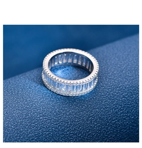 Macro detail of S925 silver ring featuring baguette-cut and pave-set cubic zirconia