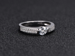 Detail of S925 sterling silver ring featuring double row micro-pave setting and S925 hallmark