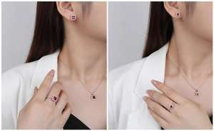 Detailed view of silver jewelry set with square ruby stones worn by a female model