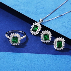 Luxury S925 sterling silver jewelry set featuring emerald-cut green gemstones