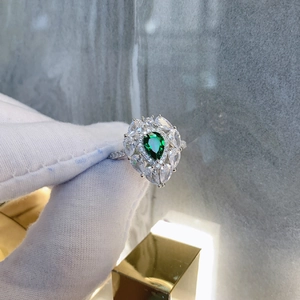 Pear-shaped green emerald ring with sparkling zircon halo and S925 silver band