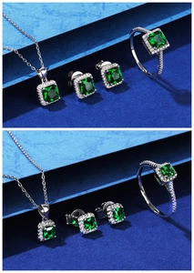Detail shot of square-cut emerald green gemstone jewelry set with halo stones in silver