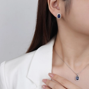 Classic silver necklace and earrings set with rectangle blue sapphire and halo crystals
