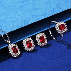 Luxurious S925 silver jewelry set with emerald-cut red gemstones and halo zircon accents