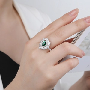 Pear-shaped green emerald halo ring in S925 silver with double-layered cubic zirconia