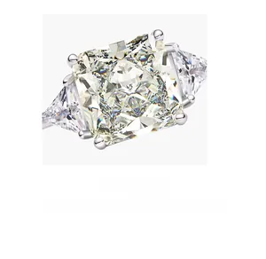 Macro shot of a three-stone high carbon diamond ring with square cut and side stones