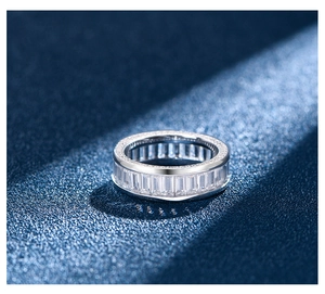 Macro shot of S925 silver ring featuring baguette-cut cubic zirconia and micro-pave setting