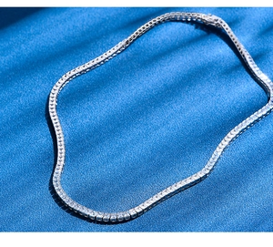 Detailed macro view of 925 sterling silver tennis necklace with 4mm cubic zirconia stones