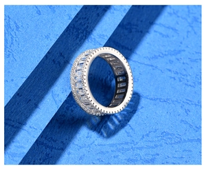 Macro detail of S925 silver ring featuring baguette-cut and micro-pave zircons