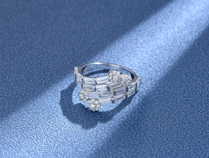 Macro detail of multi-layer S925 silver ring with baguette-cut and round crystals