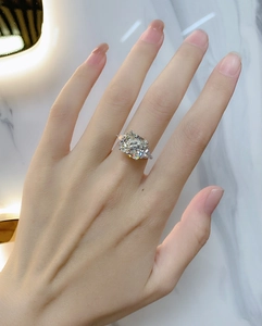 Detail of cushion cut sapphire ring with side diamonds on high-quality silver band