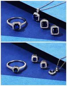 Detail view of square-cut deep blue gemstones on silver necklace, ring, and earring set
