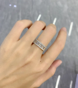 Macro view of rectangular cubic zirconia wedding band in 925 sterling silver