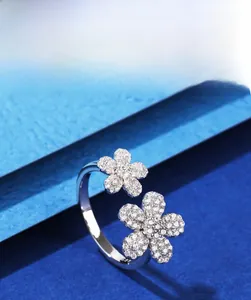 Macro shot of 925 silver ring featuring dual flowers with 5A cubic zirconia stones