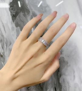 Macro shot of S925 sterling silver band ring featuring emerald cut cubic zirconia